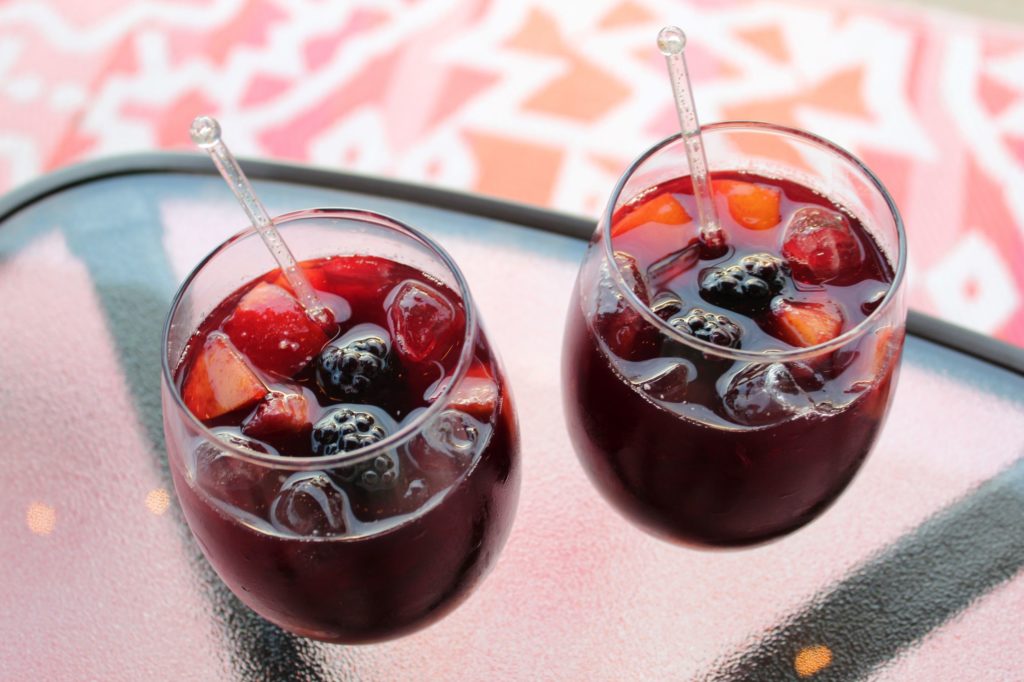 red sangria with nectarines, grapes and blackberries